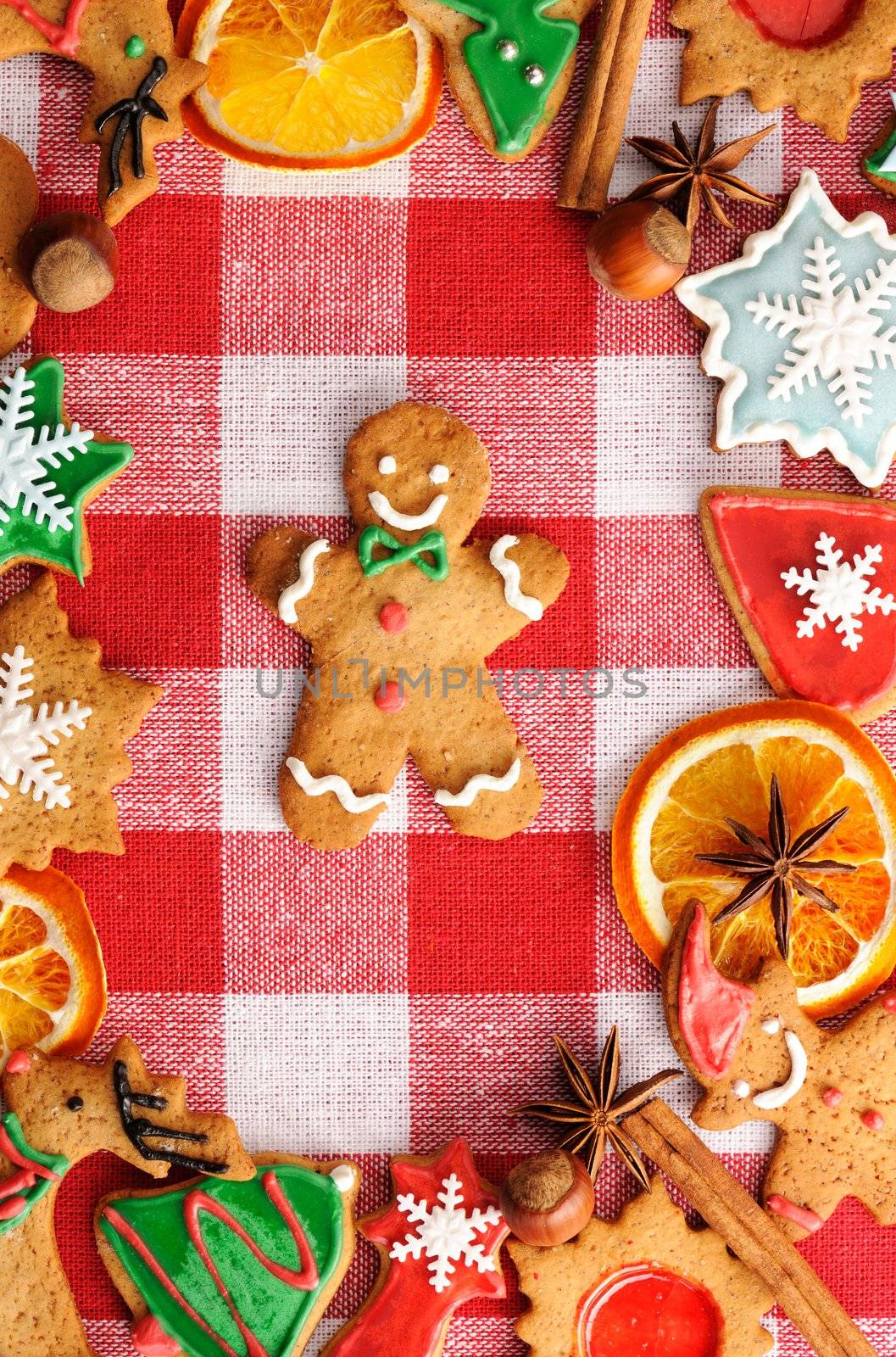 Christmas gingerbread man cookie over tablecloth