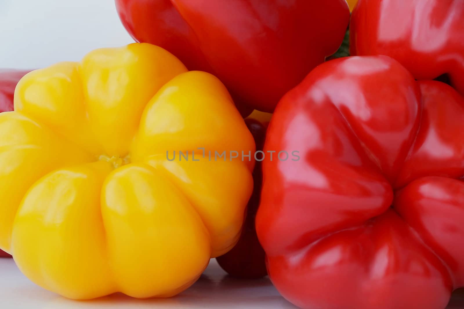 Image of red and yellow raw pepper