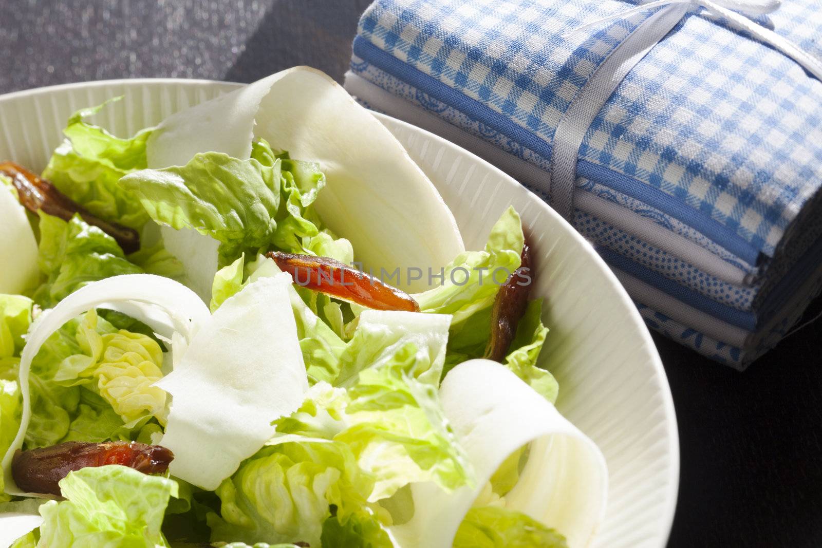 Fresh healthy salad with dates and jicama or parsnip