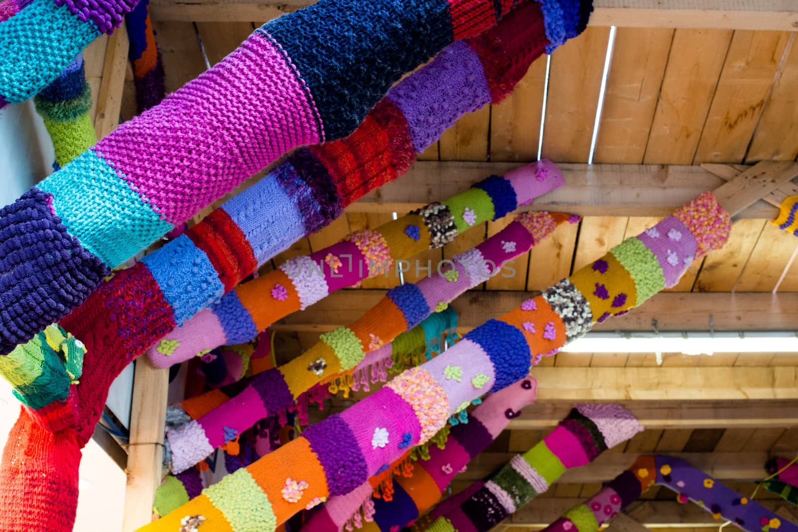 Guerilla Knitting or Urban Knitting or Yarn Bombing - A innovative form of graffiti using knitted yarn. Here a construction site is decorated.