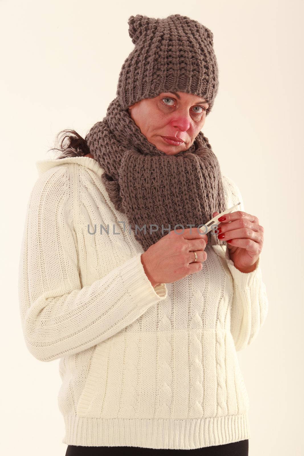 elderly woman with thermometer in hand