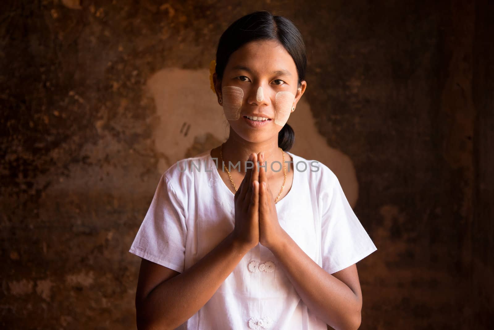 Myanmar woman in a traditional welcoming gesture