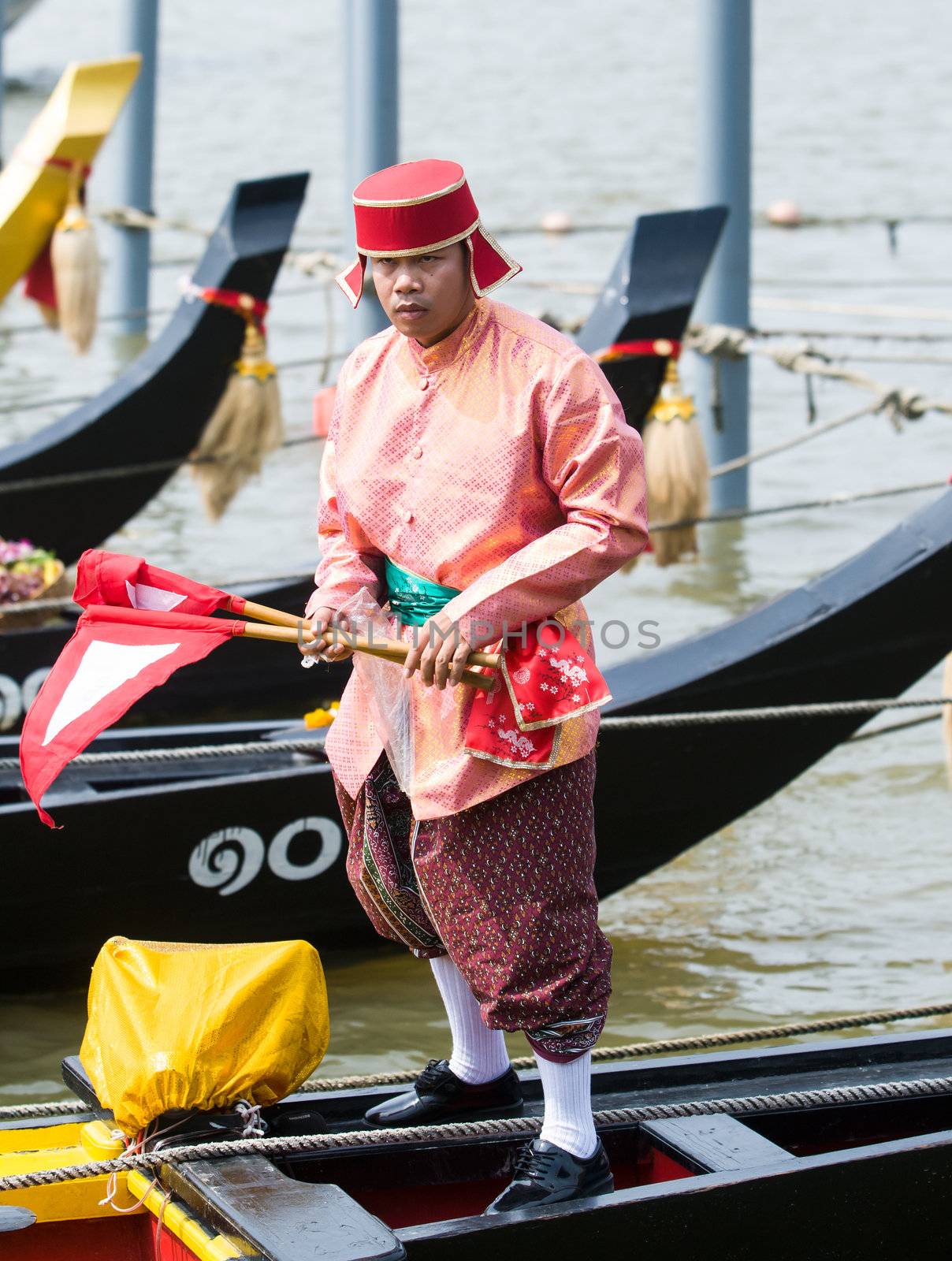 BANGKOK - NOVEMBER 2: Soldier participating at a dress rehearsal for the Royal Barge Procession to celebrate the 85th birthday of King Bhumibol Adulyadej in Bangkok, Thailand on November 2, 2012.