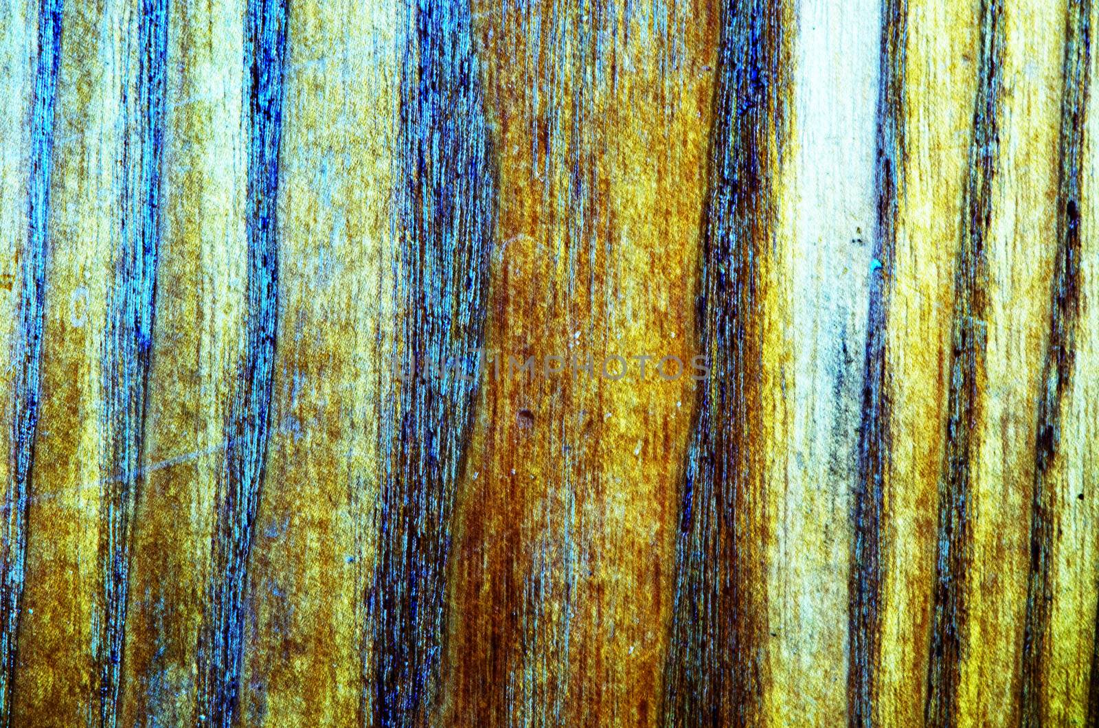 Background of blurred brown wood imitation furniture texture.