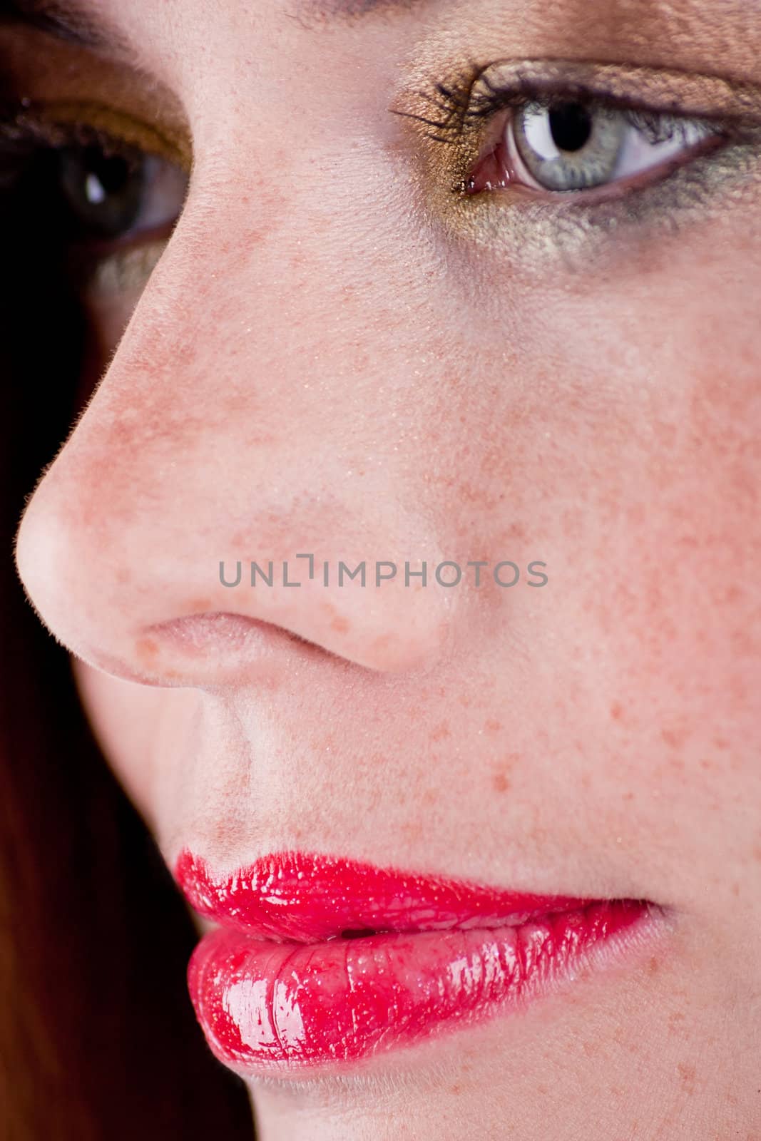 beautiful young woman portrait with freckles profile close up
