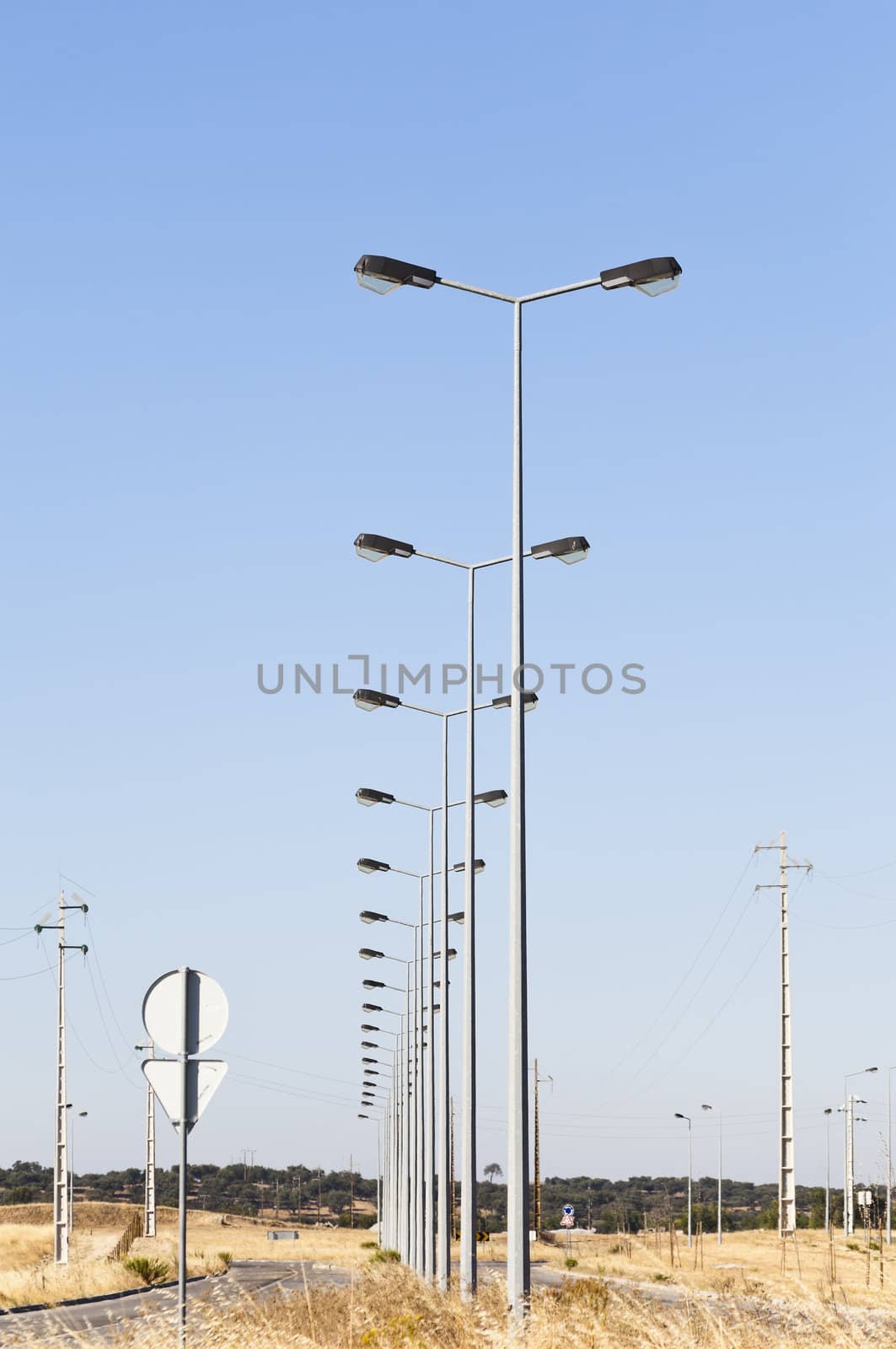 Street lights in fully infra-structured vacant lots ready for construction in the industrial park of Evora, Portugal
