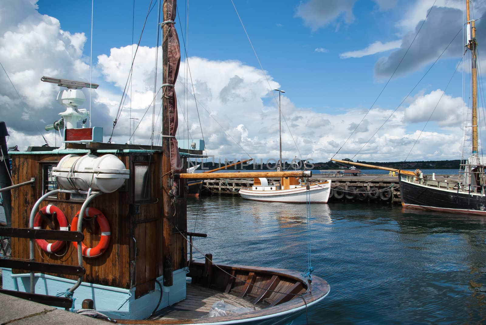 Fishing boats in a port by Ronyzmbow