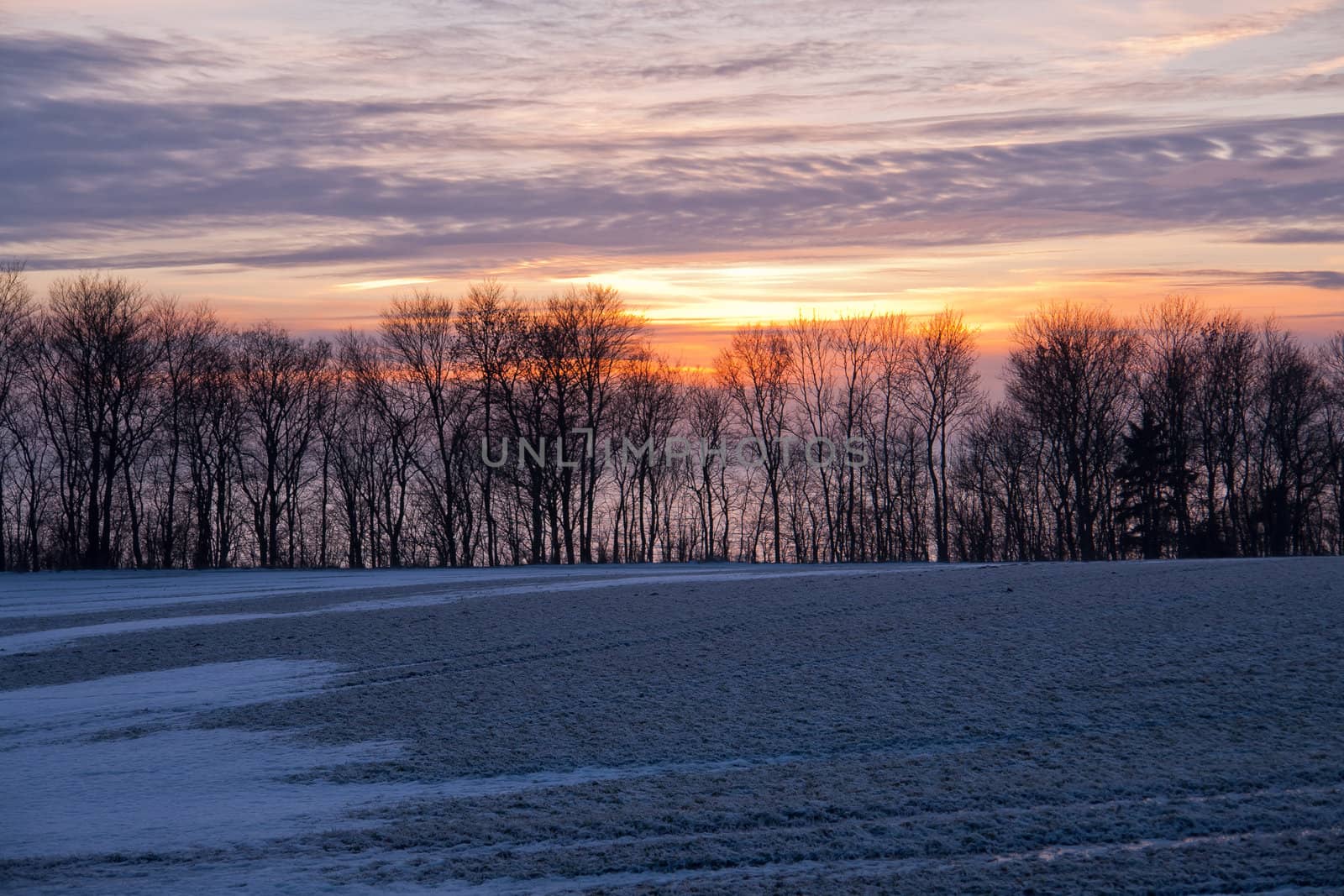 Beautiful dramatic winter sunset by Ronyzmbow