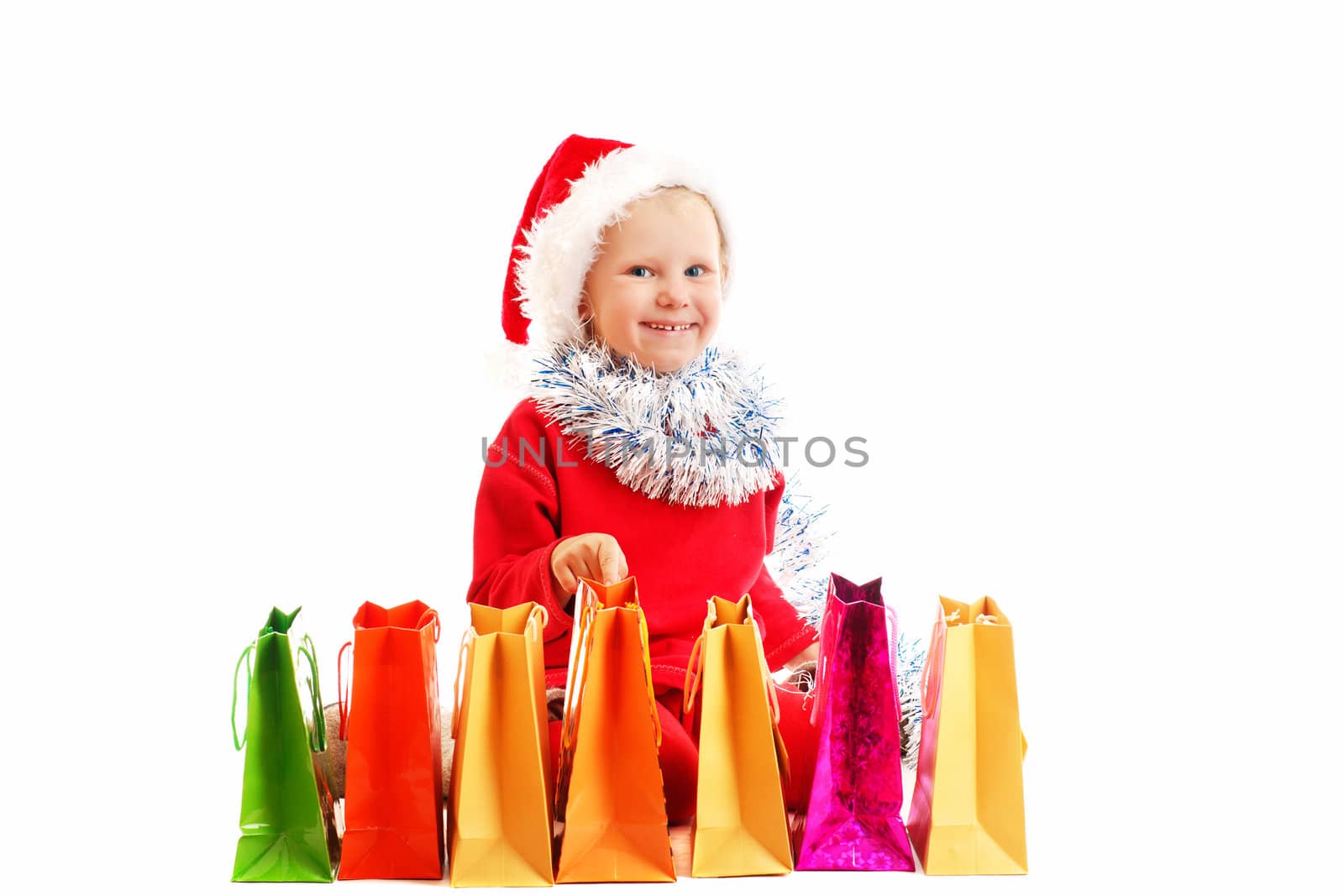 child  in red cap with presents by vsurkov