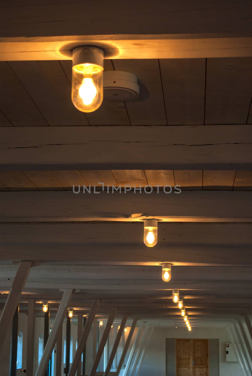 Rustic traditional country style ceiling with white wooden beams and lamps