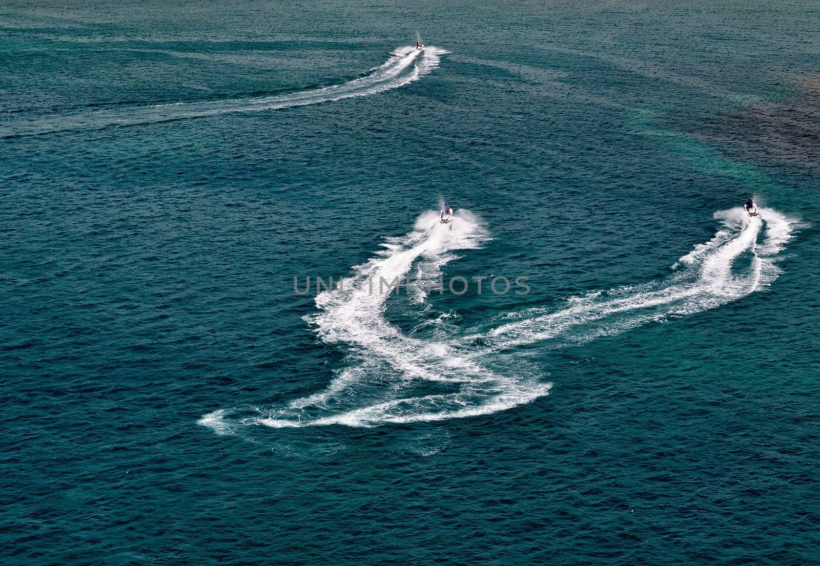 Three wave runner riders enjoy a day in the Caribbean.