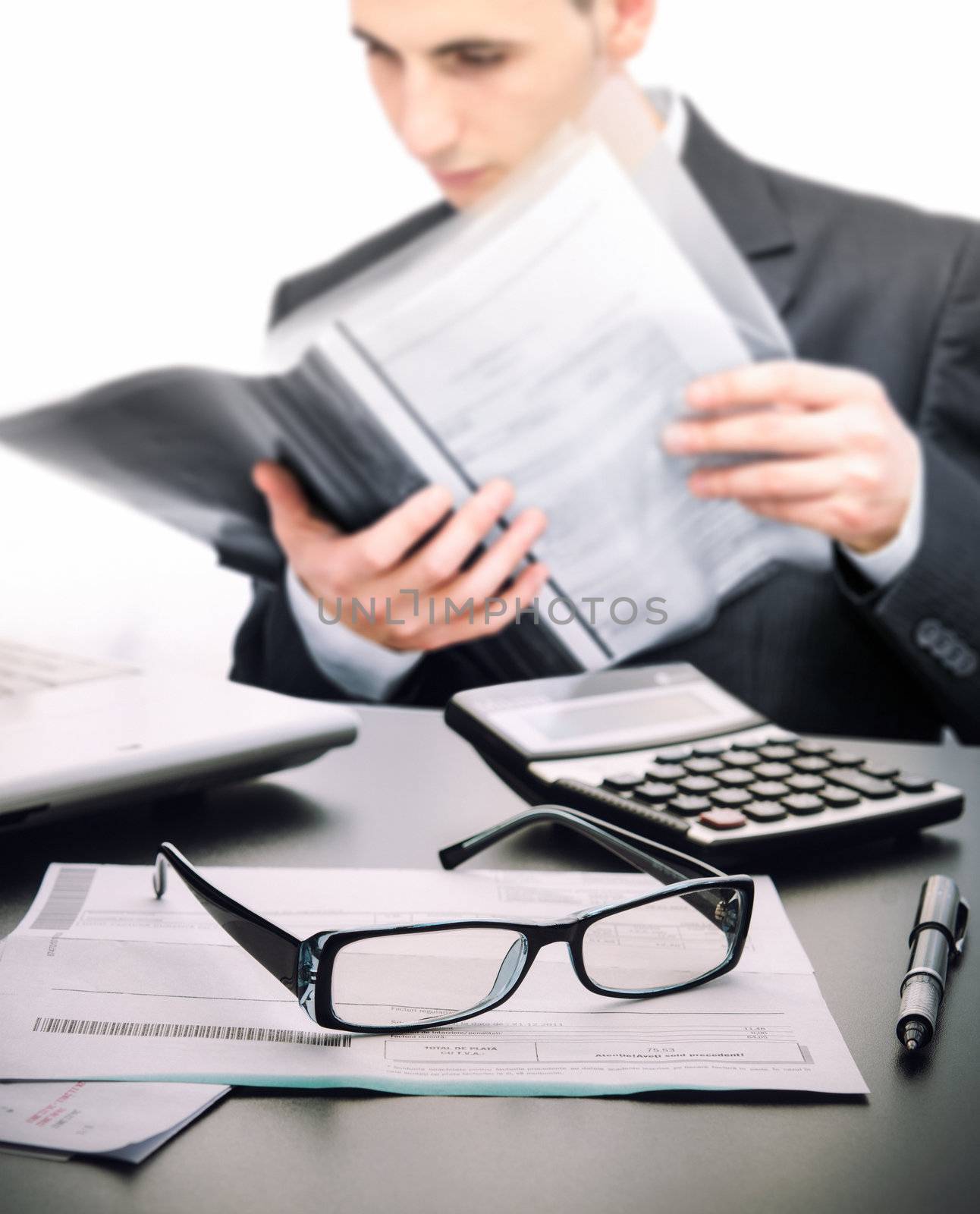 Account manager at office reading a legal contract