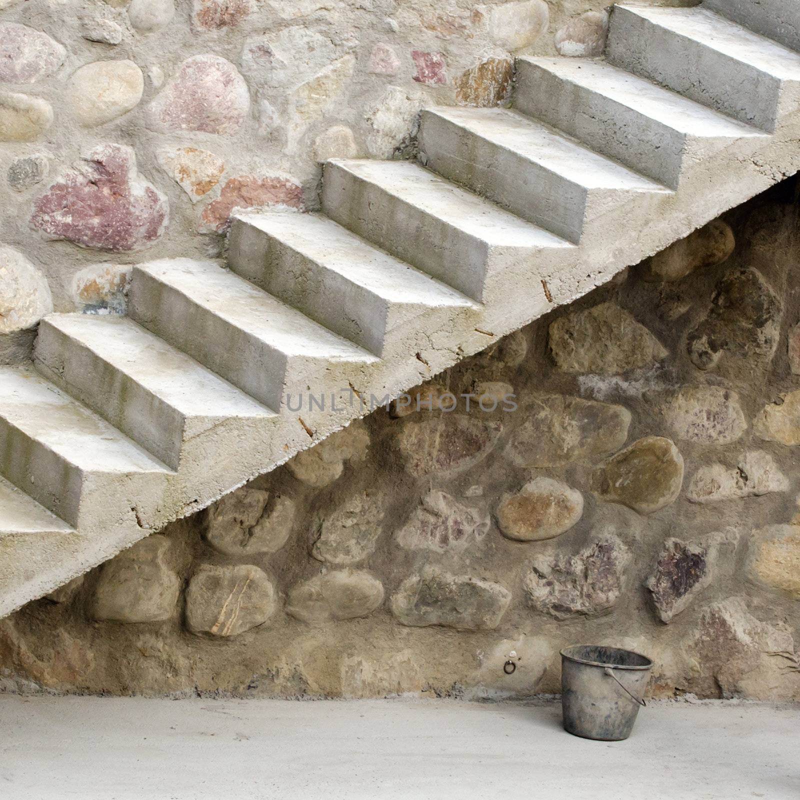 Residential structure with stone wall and stone stairs