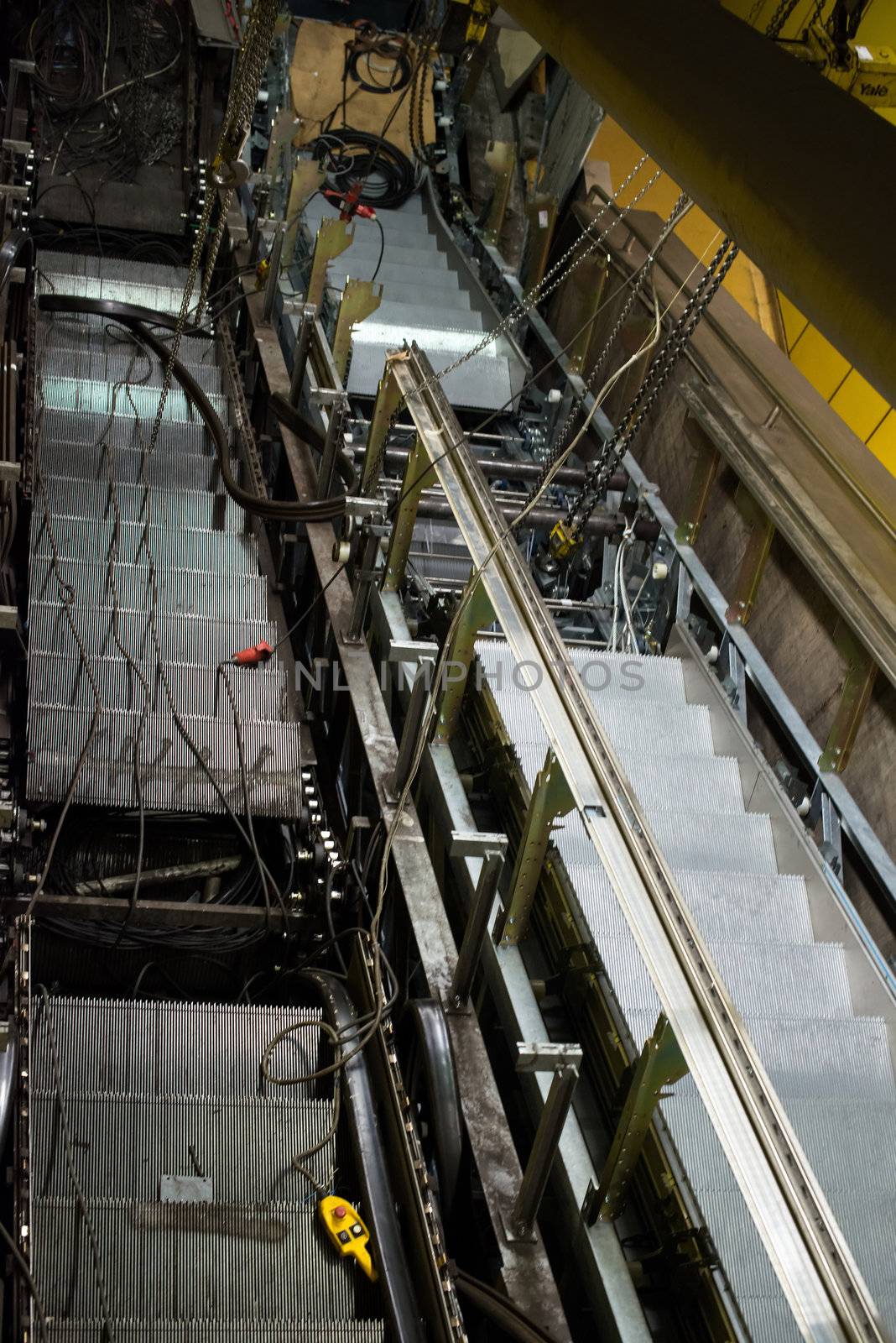 Installation of a new escalator during renovation works in a metropolitan railway station using heavy machinery