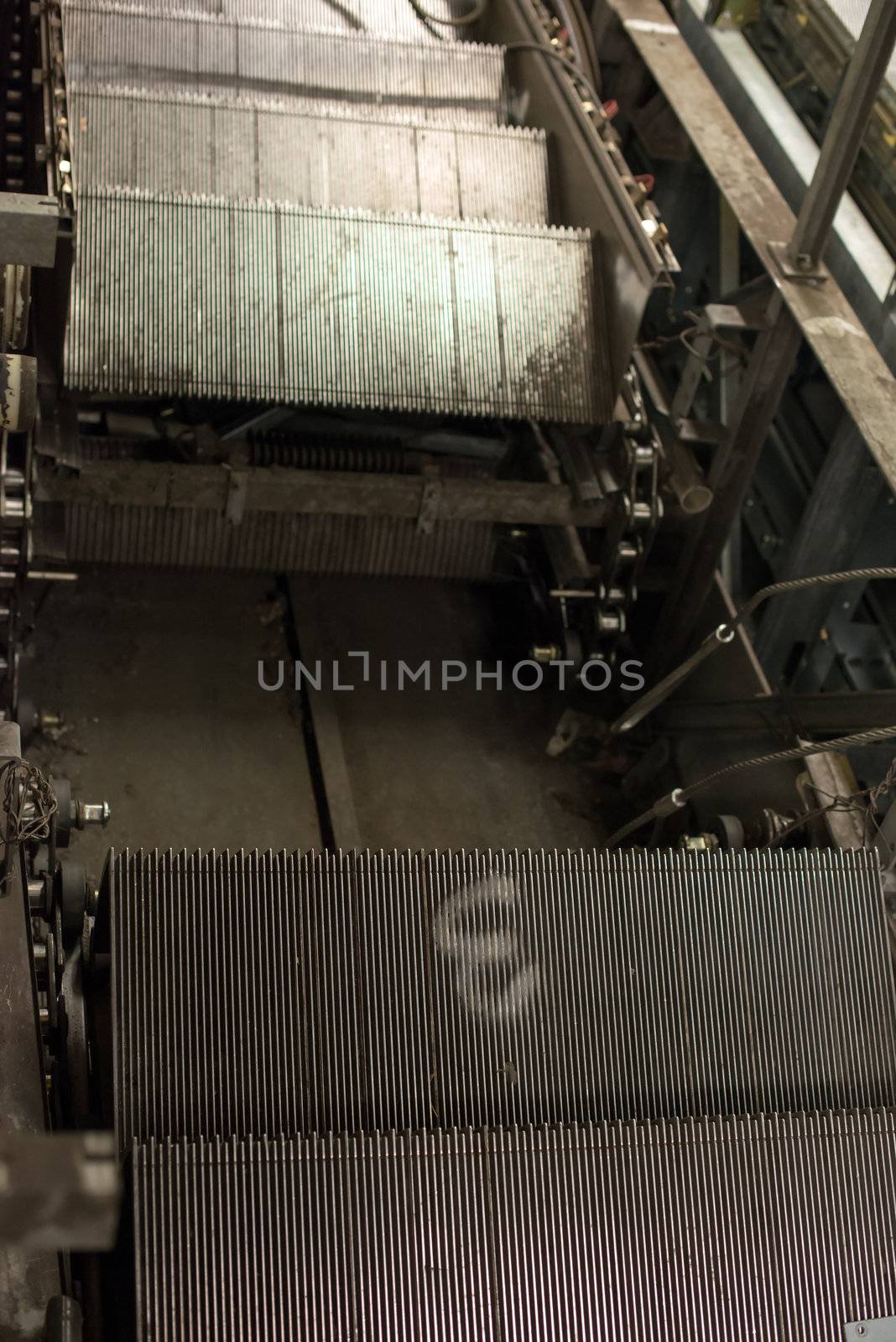 Installation of a new escalator during renovation works in a metropolitan railway station using heavy machinery