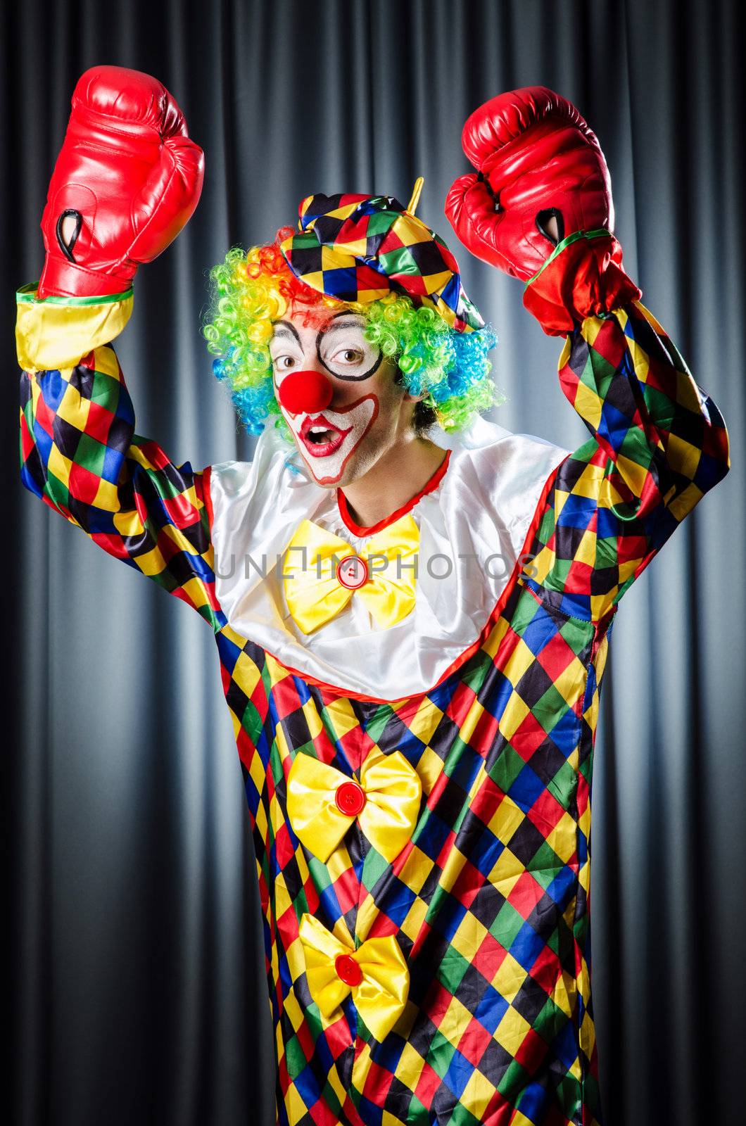 Funny clown in the studio shooting