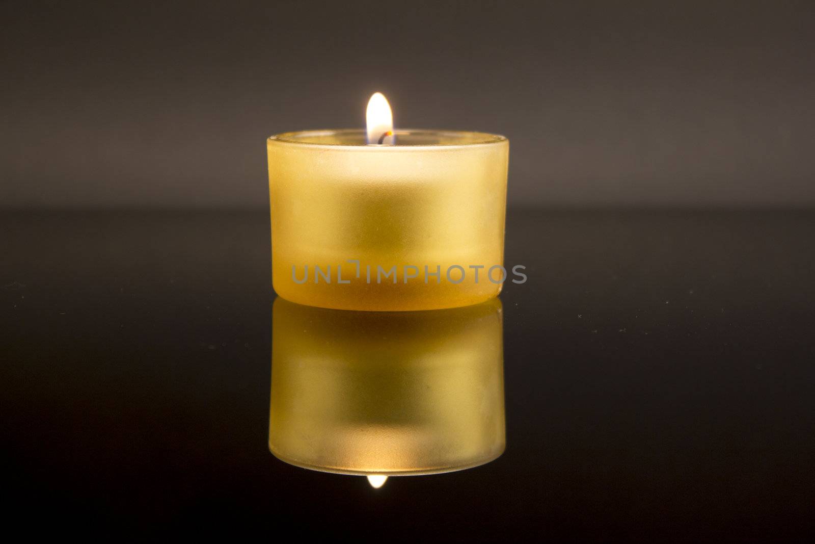 Burning yellow candle