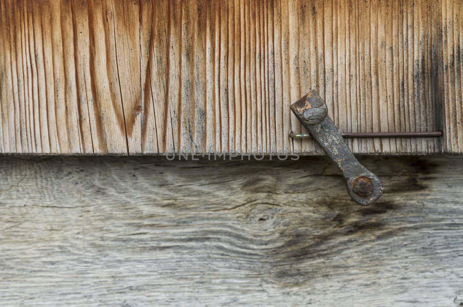detail of wooden window shutter on old house