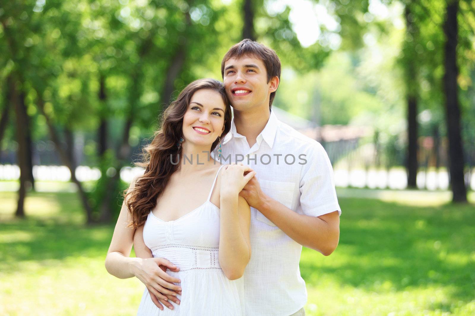 Young love Couple smiling under blue sky by sergey_nivens