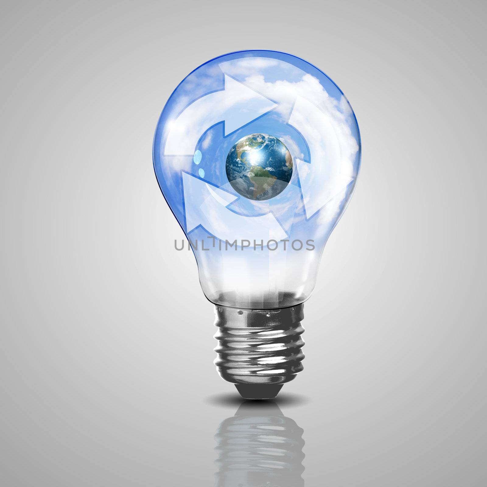 Electric light bulb and our planet inside it as symbol of green energy