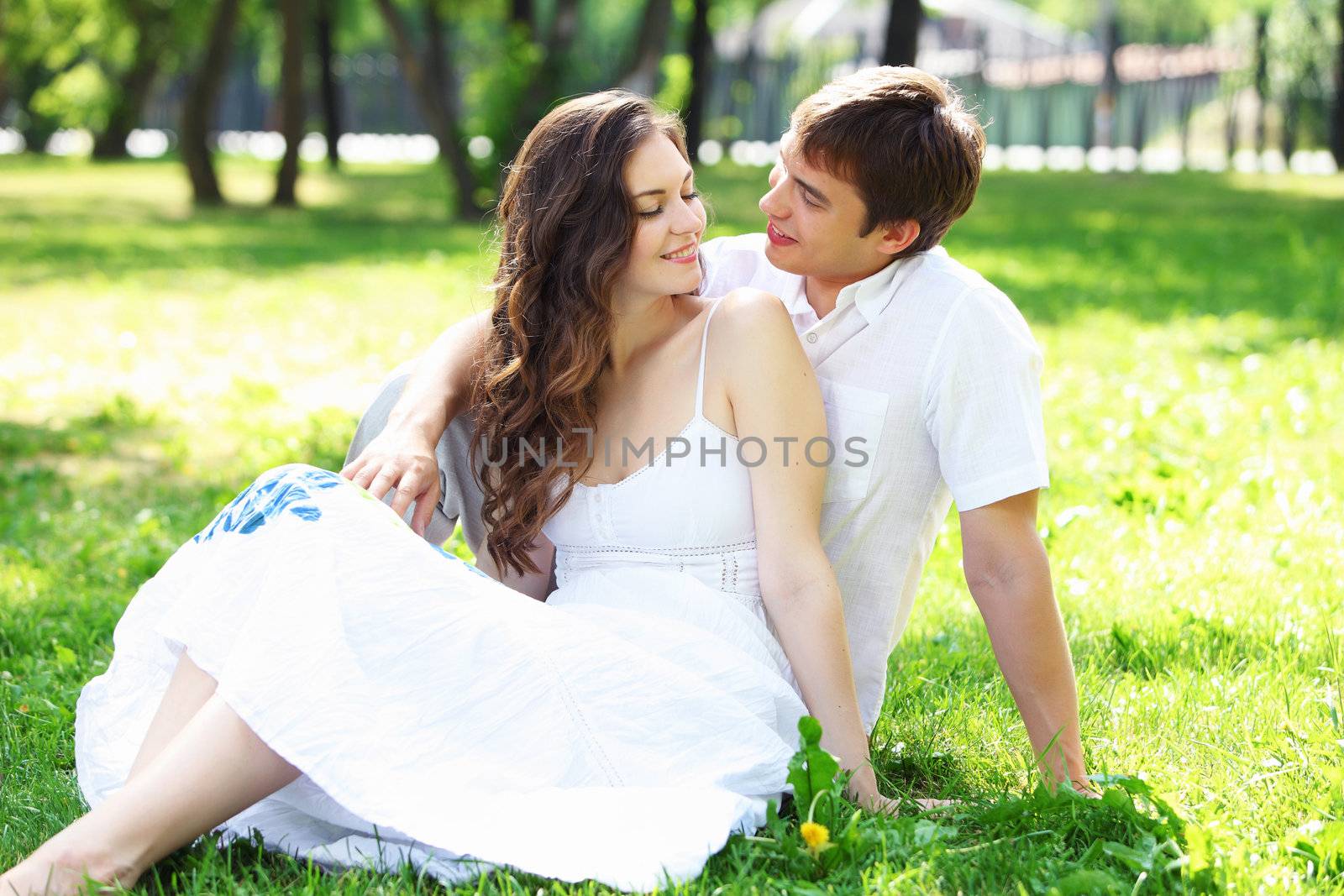 Young love Couple smiling under blue sky by sergey_nivens