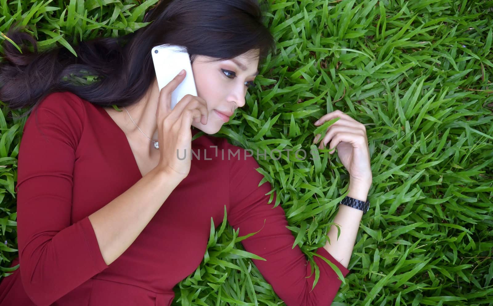 pretty woman making a phone call in the garden