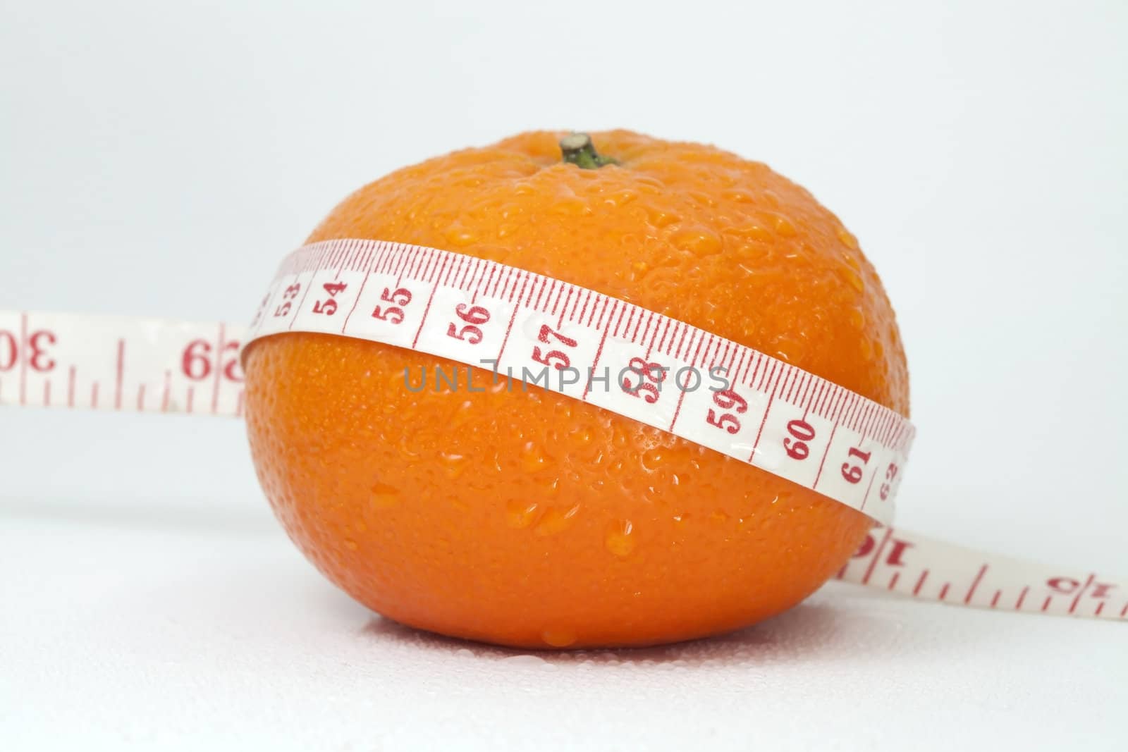 Orange and measuring tape