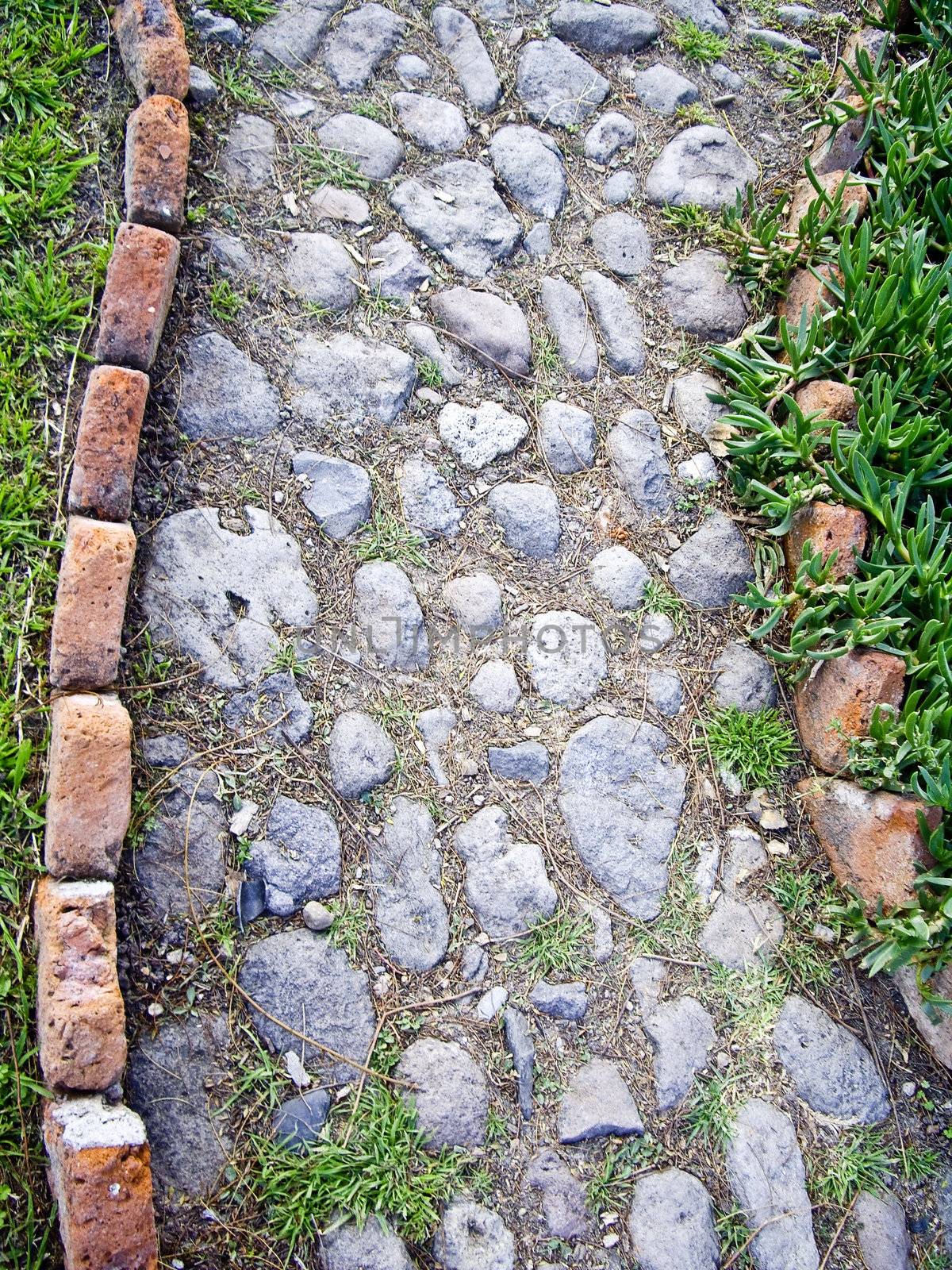 Path of decorative stones and brick