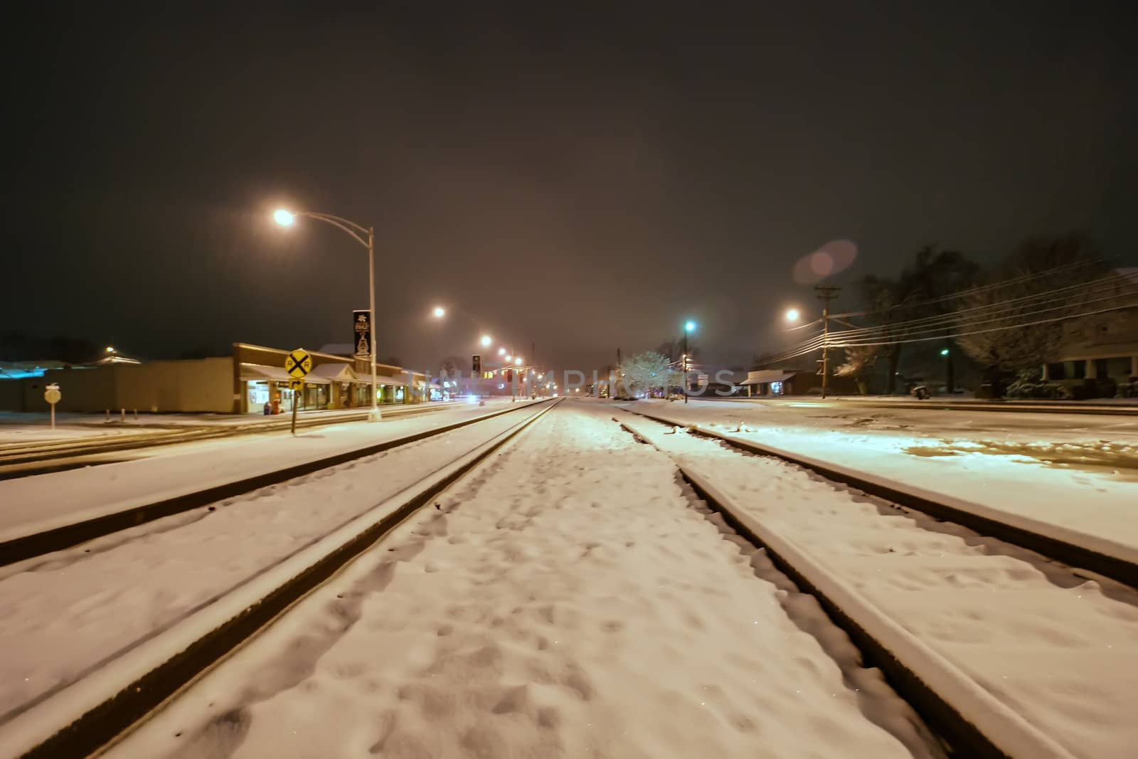 snow covered train tracks by digidreamgrafix