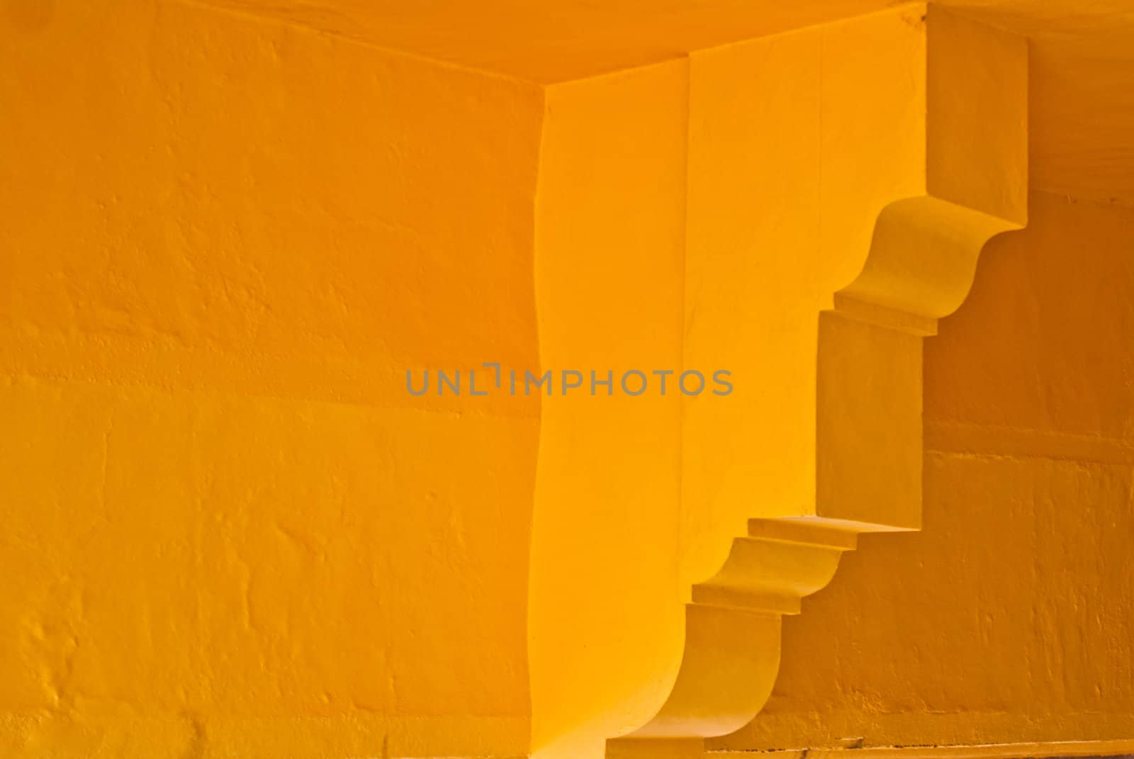 Yellow adobe walls with arcitectural details Mexico