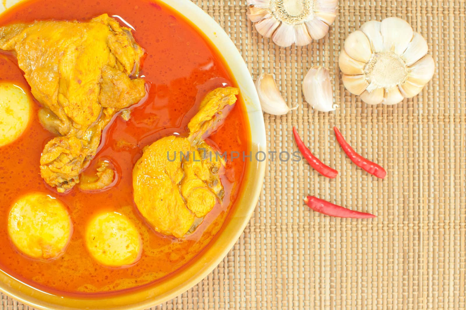 Most delicious spicy Thai food, Chicken curry (Mussaman curry) on bamboo mat background