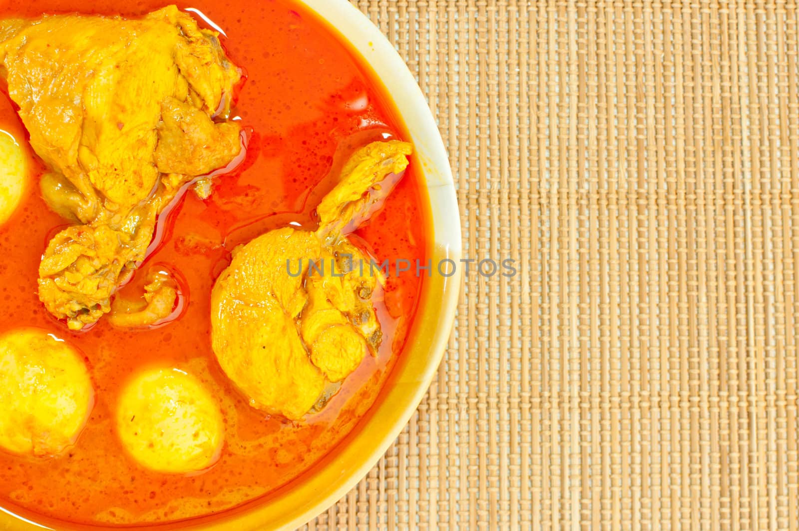 Most delicious spicy Thai food, Chicken curry (Mussaman curry) on bamboo mat background