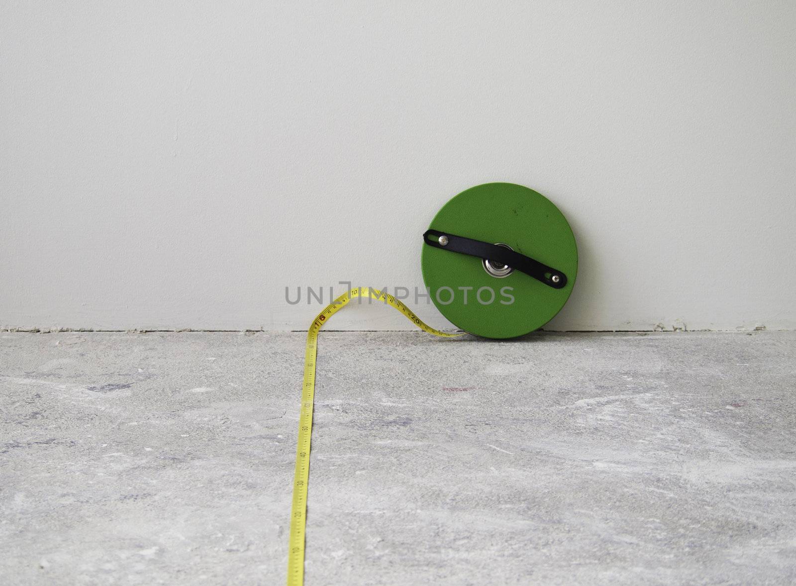 Construction Measuring Tool on concrete background