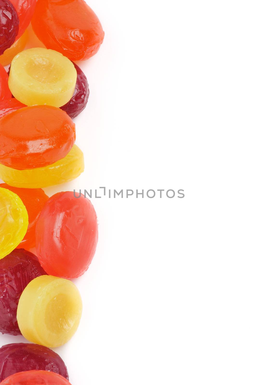 Frame of Multi Coloured Fruit Drops isolated on white background