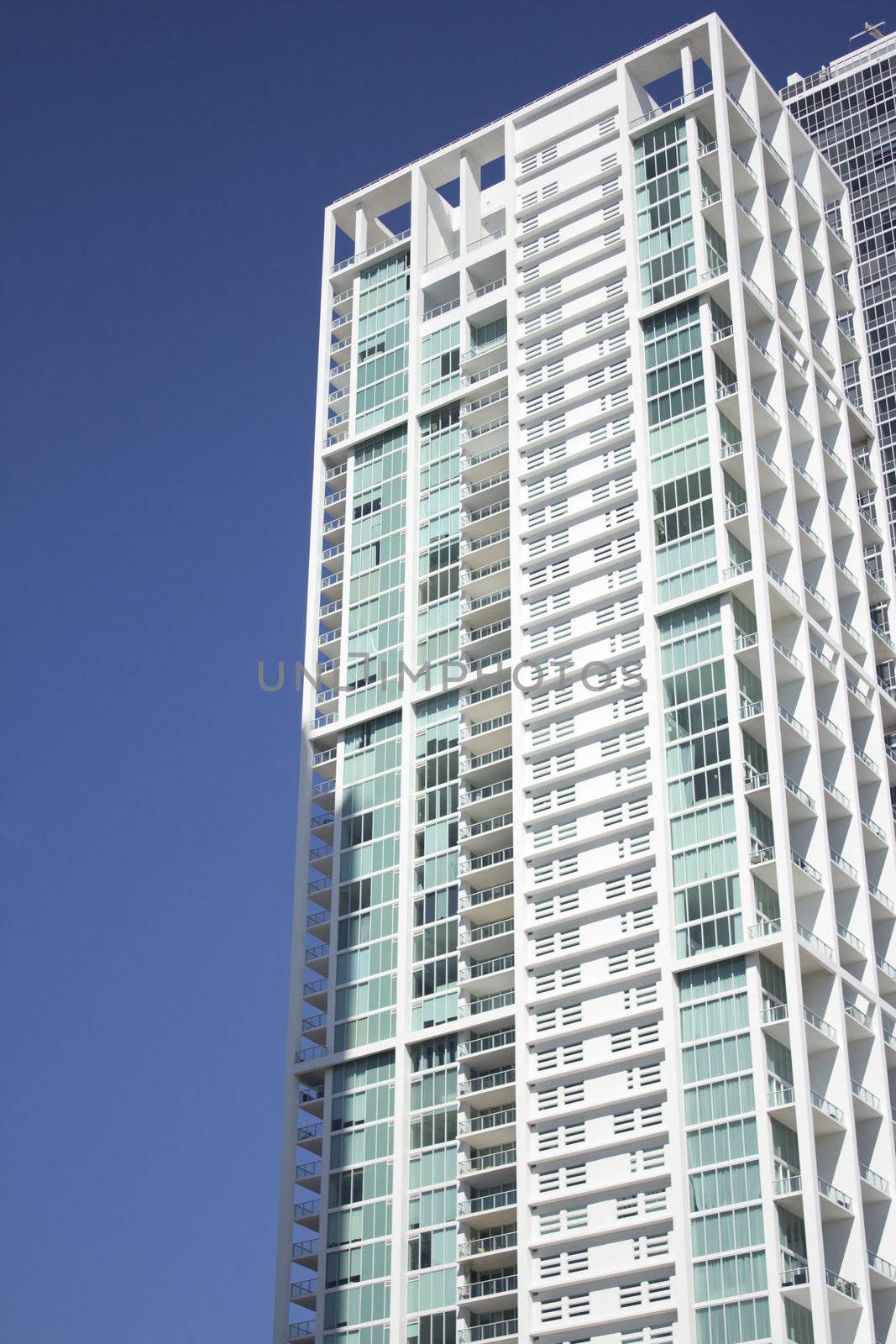 Office Buildings or Condos with a blue sky by jeremywhat