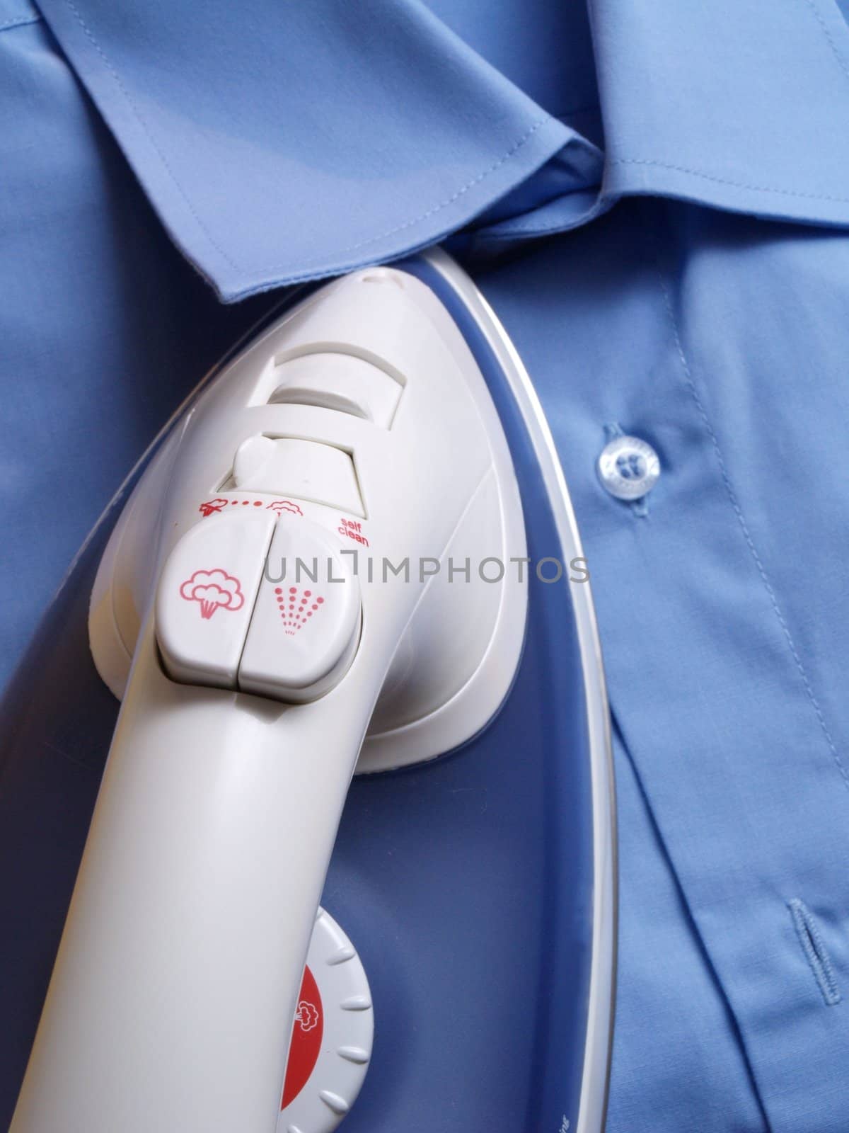 Ironing blue shirt by anderm