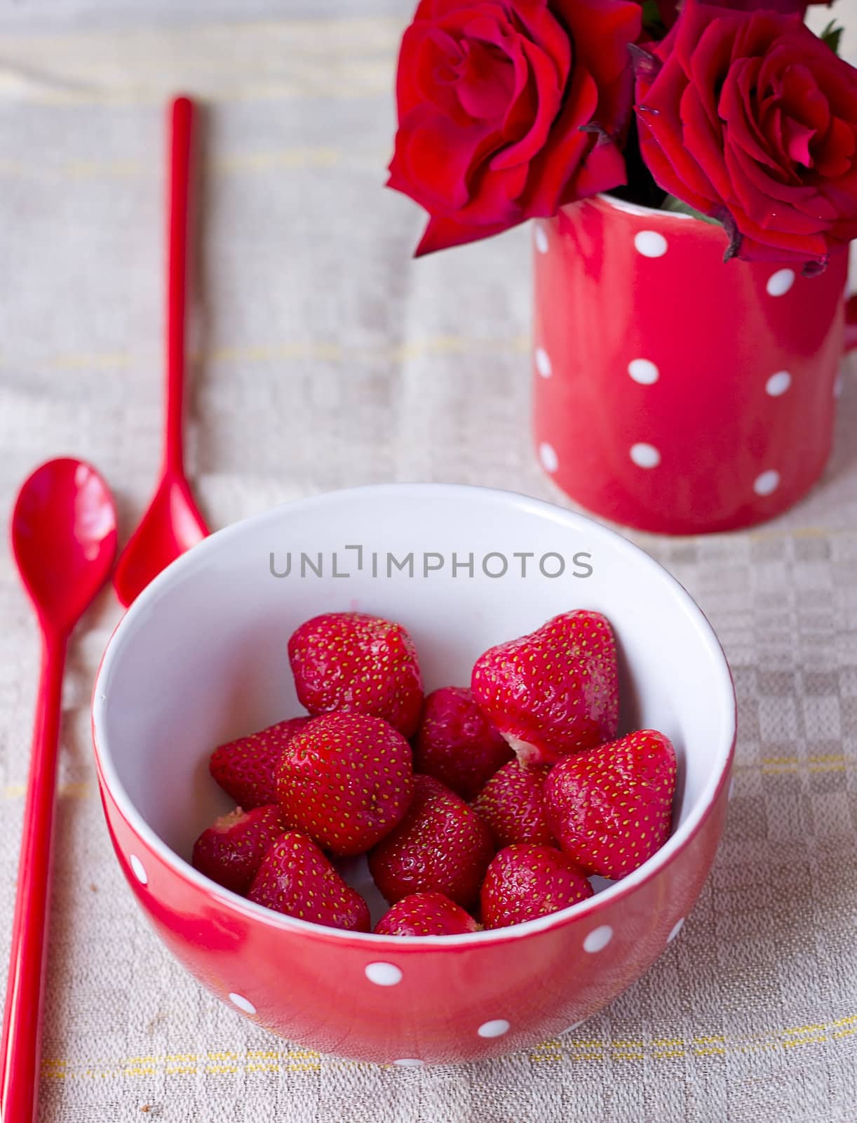 Red bowl with strawberries for breakfast by victosha