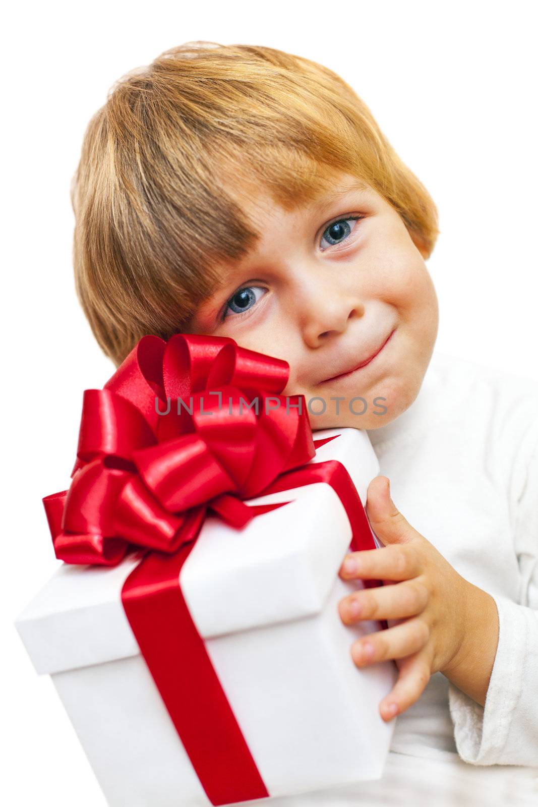 Smiling Boy holding present box isolated on white