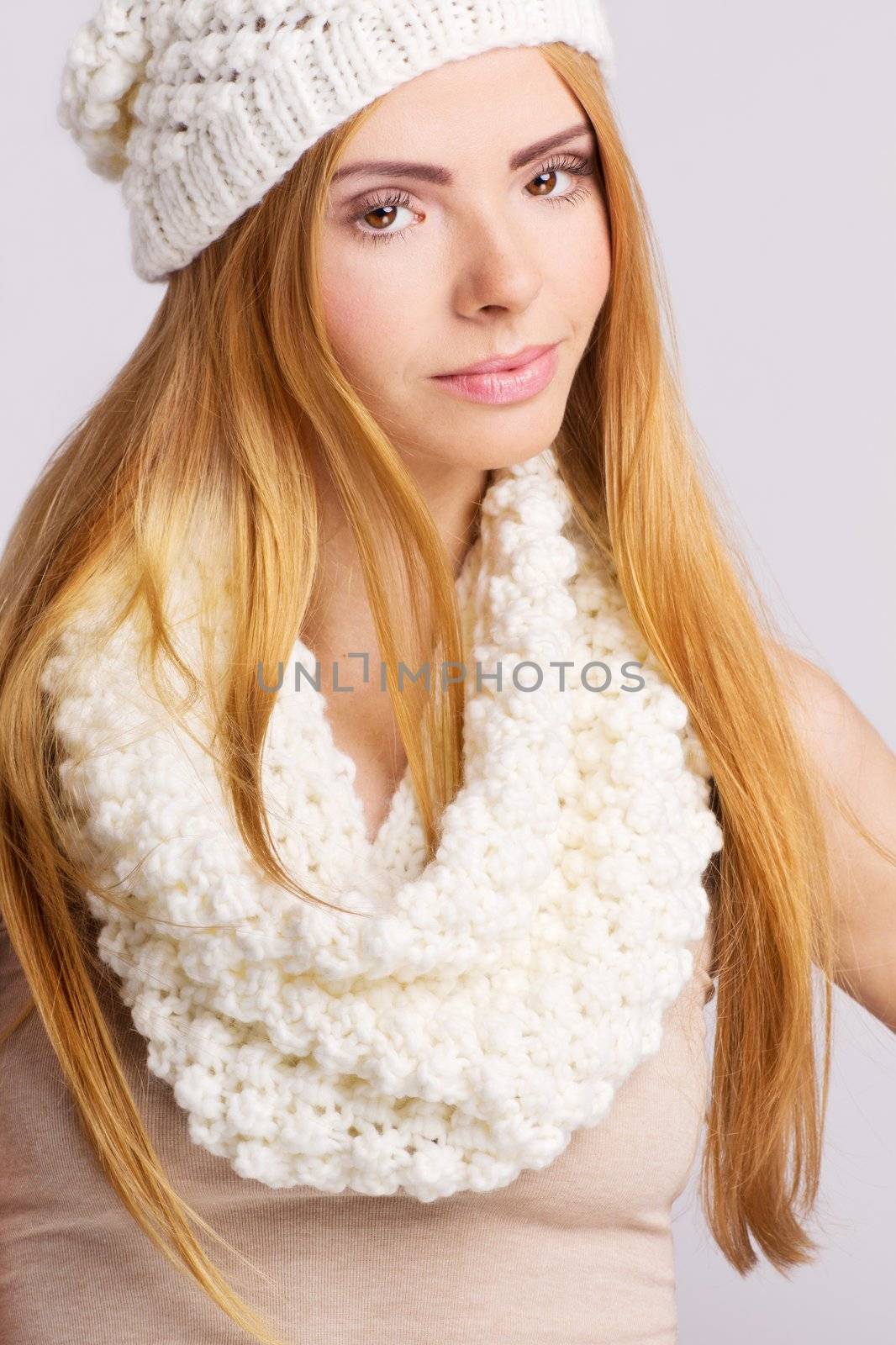 Young woman wearing white woolen hat and muffler by JustineOctop