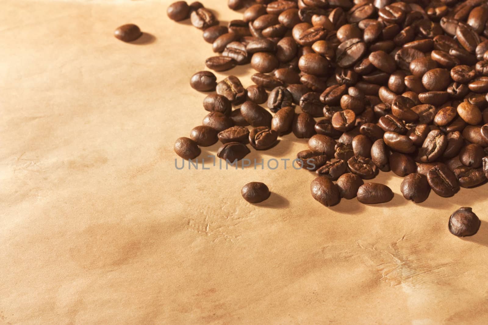 Pile of coffee beans on old paper