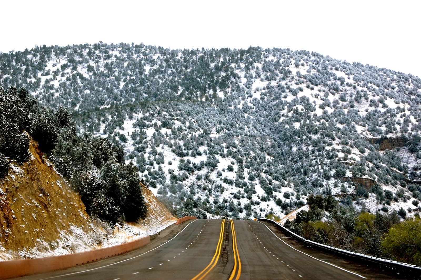 Road into the mountainside  by RefocusPhoto