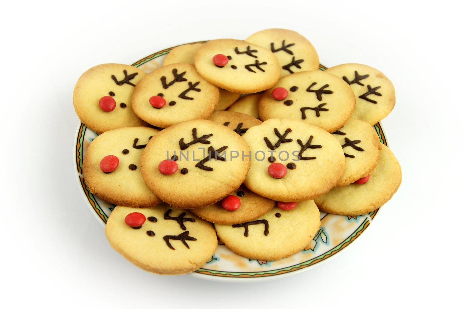 Christmas reindeer cookies on plate by simpson33