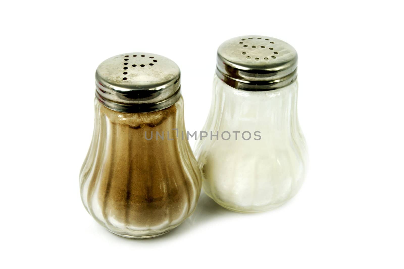 Salt and pepper shaker on white by simpson33