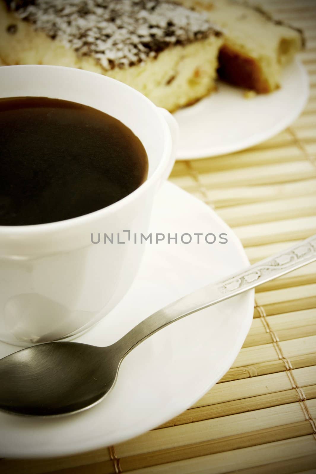 Coffee and cheesecake on bamboo mat by simpson33