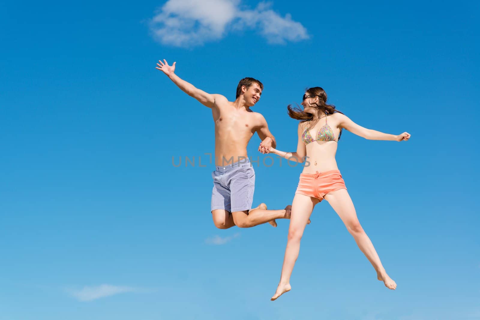 couple jumping together by adam121