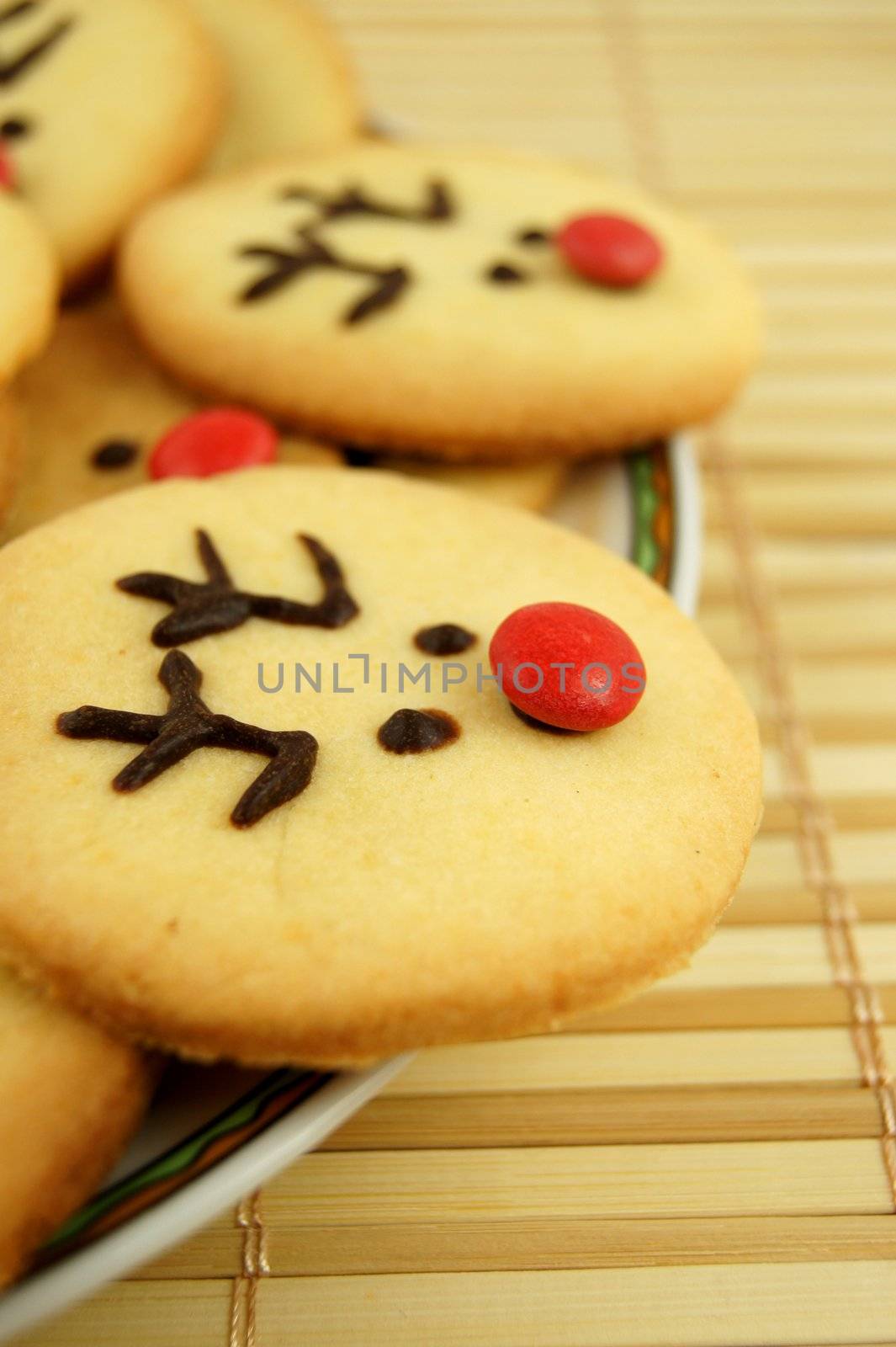 Christmas reindeer cookies on plate by simpson33