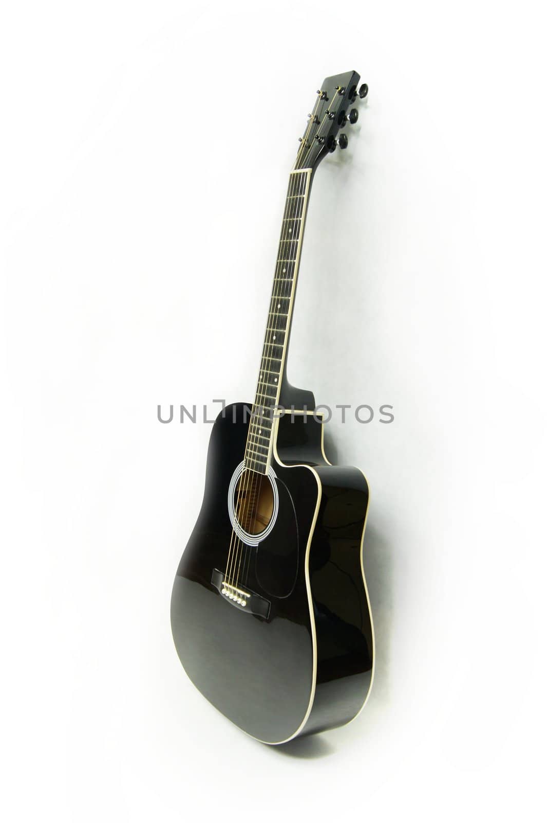 Black electro-acoustic guitar on white by simpson33
