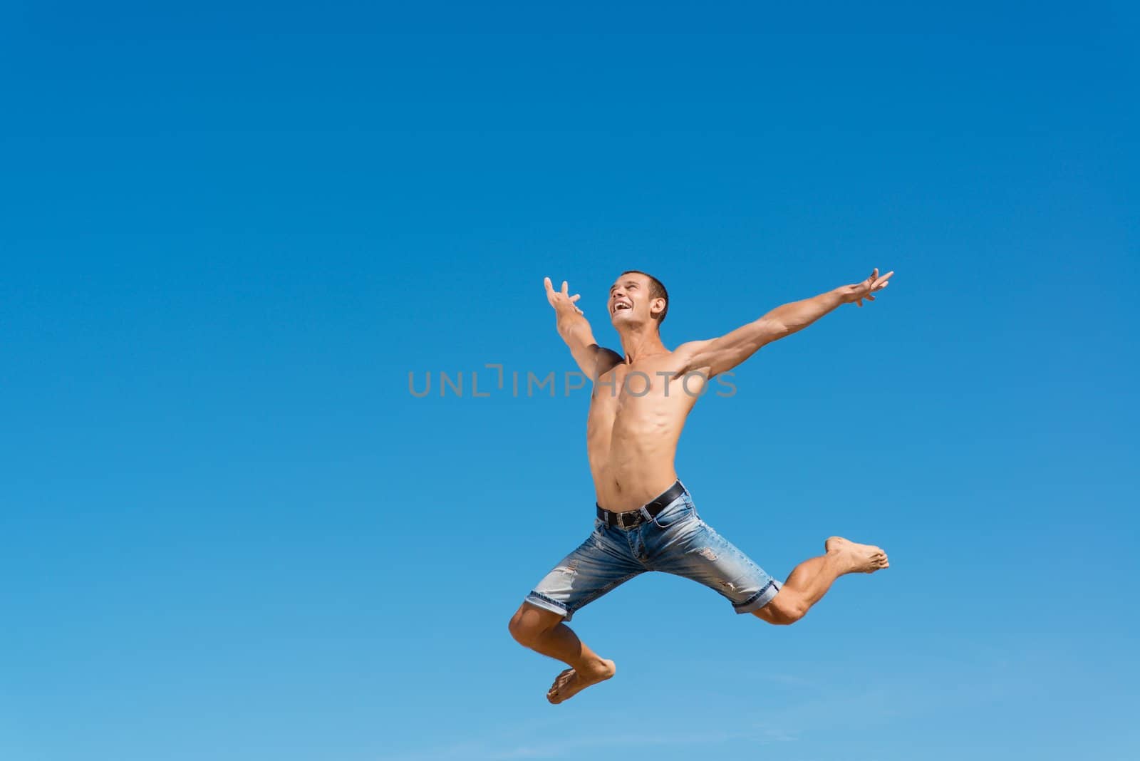 man jumping on the blue sky background, a good time