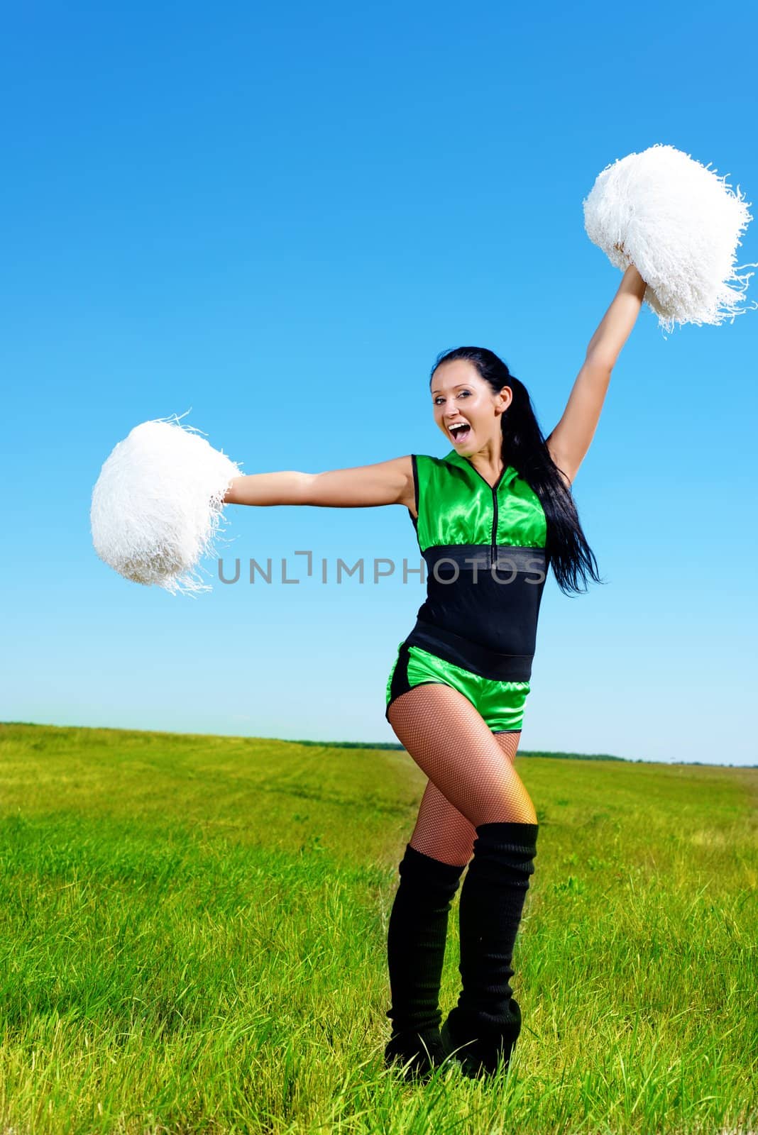 cheerleader girl on a background of blue sky