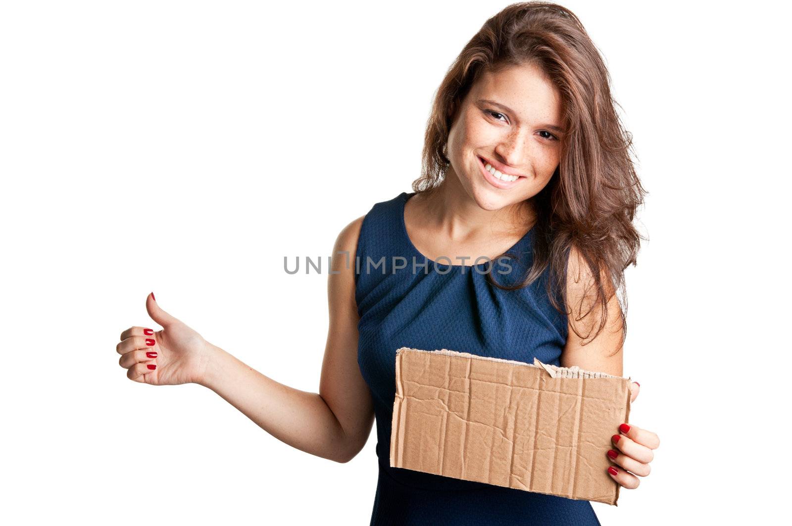 Young woman hitch hiking, holding a cardboard, isolated on a white background